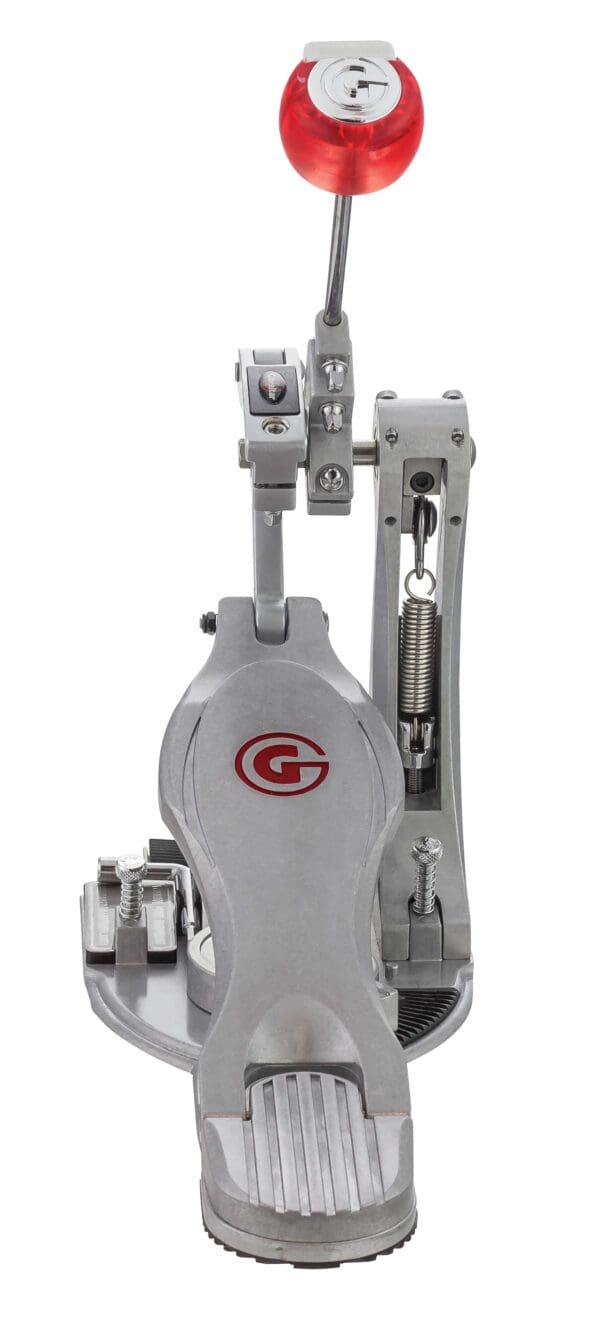 A metal drum pedal with a red handle.