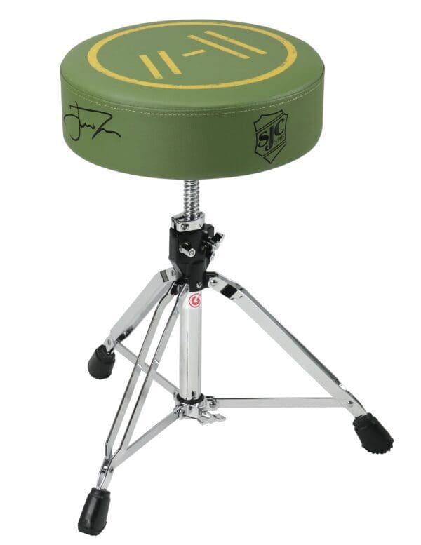 A green drum stool with a logo on it.