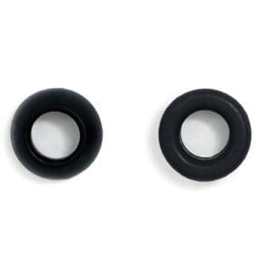 A pair of black ear studs on a white surface.