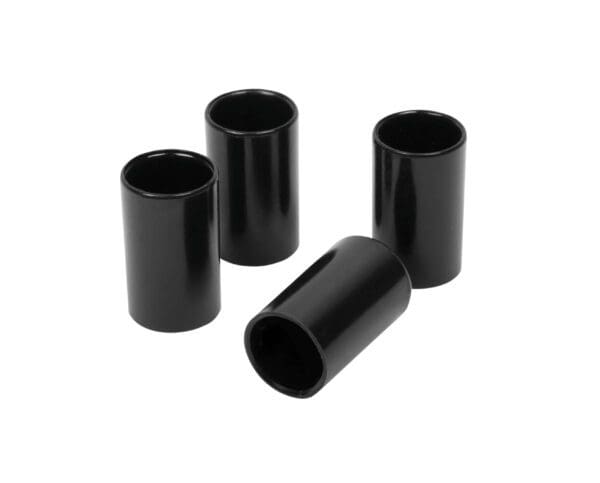 Four black plastic cylinders on a white background.