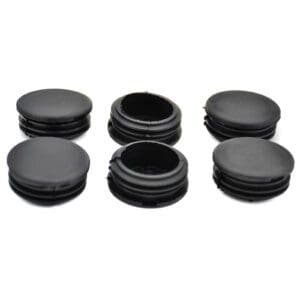 A set of black plastic knobs on a white background.