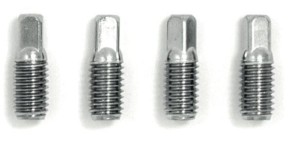 Four stainless steel screws on a white background.