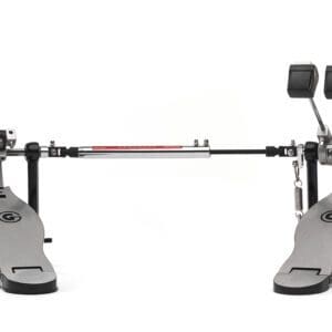 A metal drum pedal with a red knob.