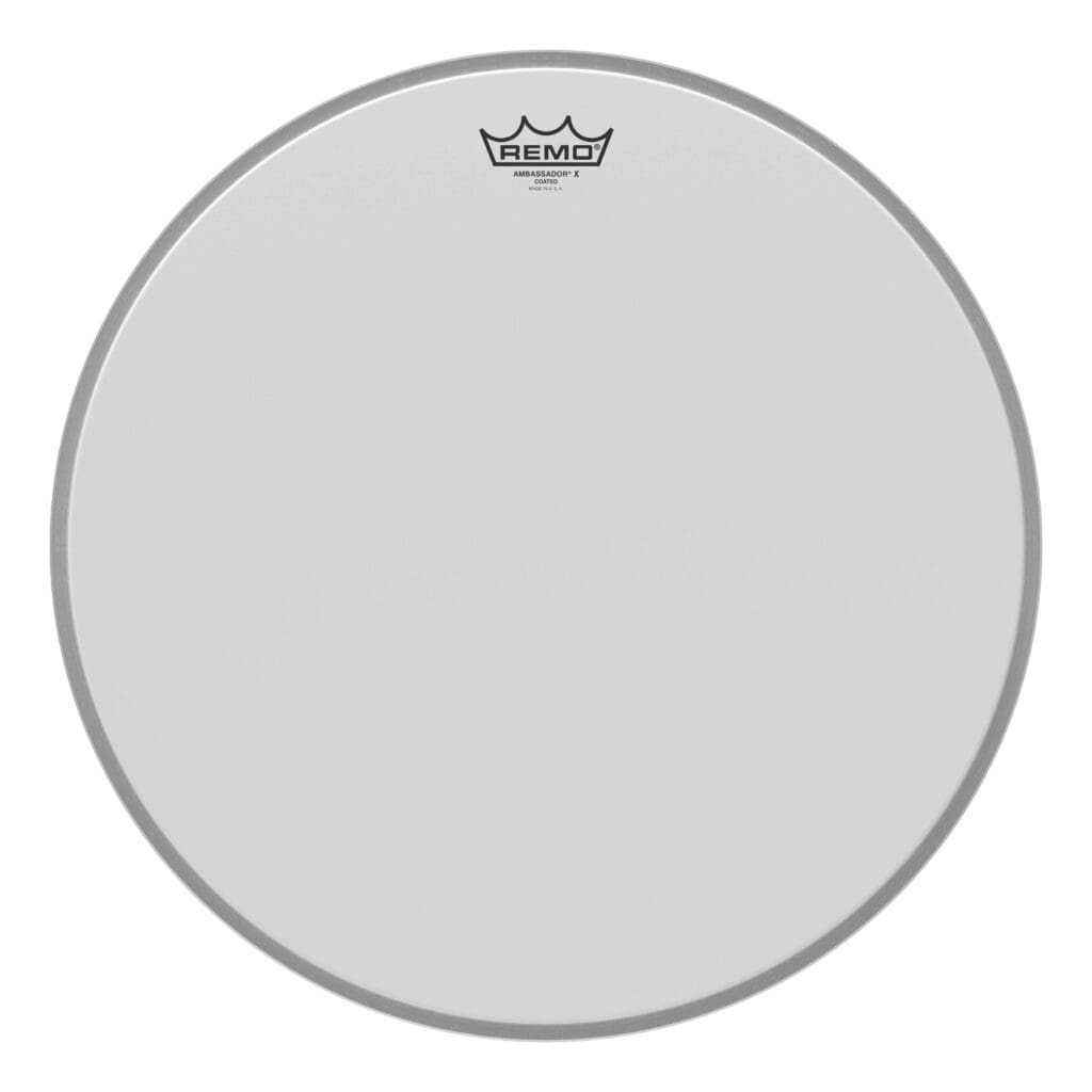 A white drum head with a crown on it.