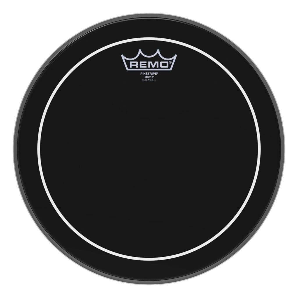 A black drum head with a white logo.