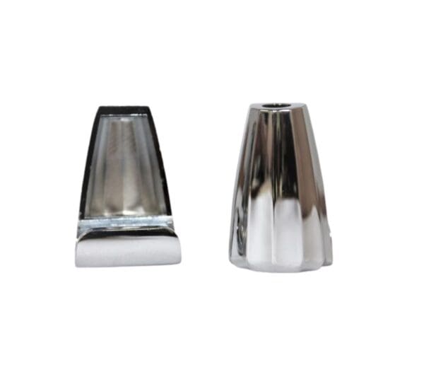 A pair of chrome candle holders on a white background.