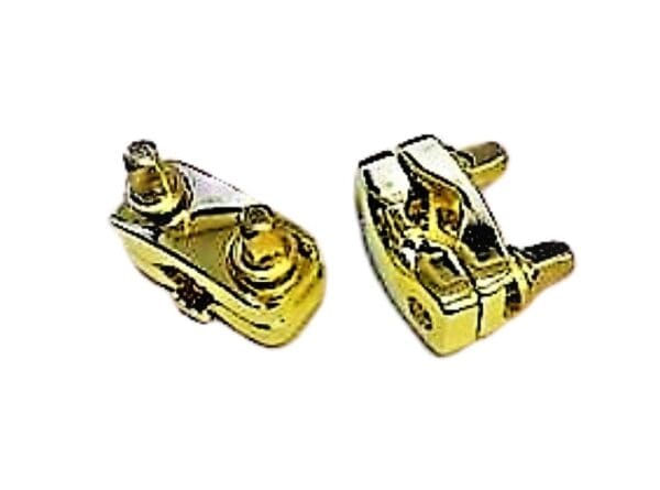 A pair of gold plated switches on a white background.