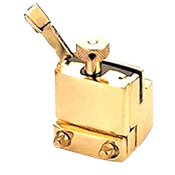 A gold plated latch on a white background.