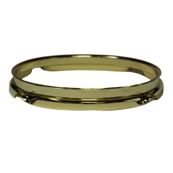 A gold plated bangle ring on a white background.