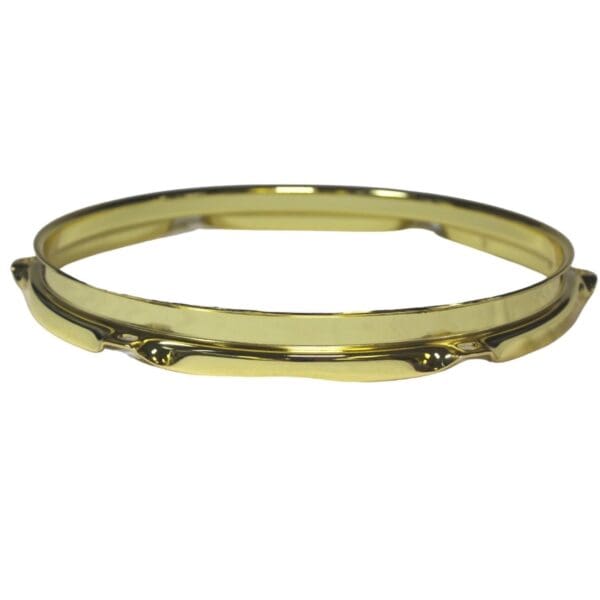 A gold plated bangle bracelet.